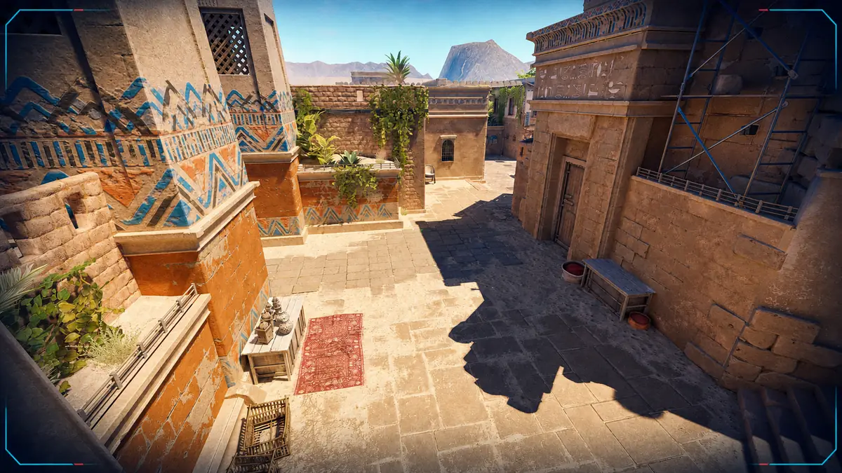Sunlit Ancient courtyard in Counter-Strike 2 with restrained EsportsNews.pro broadcast framing